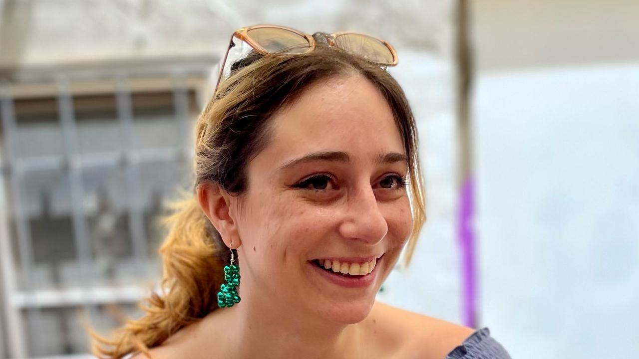 A portrait of Kat Di lulio smiling