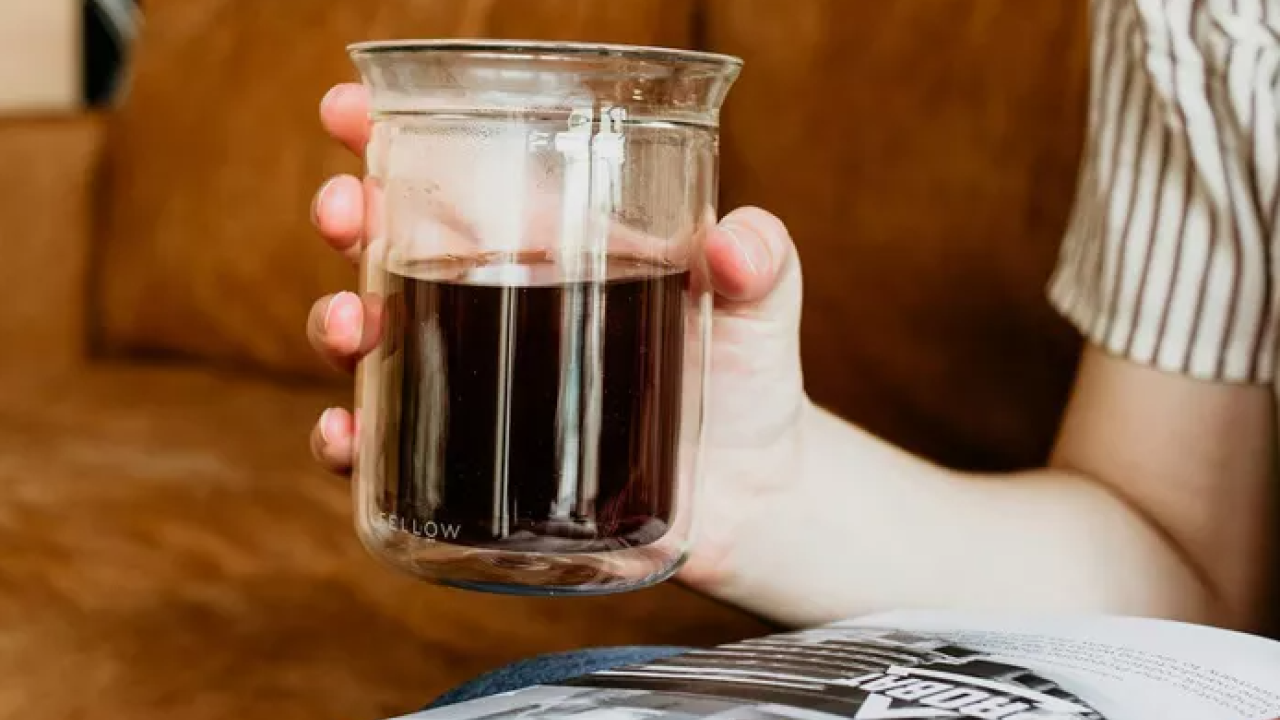 A person holding a cup of coffee
